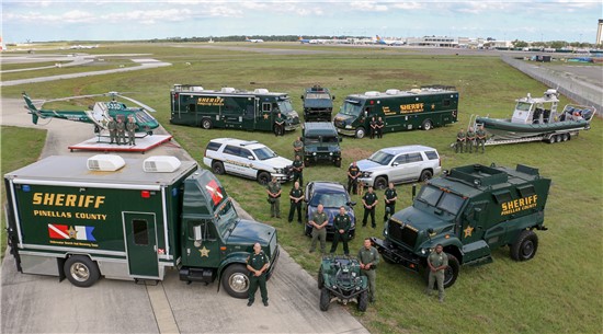 Photo of Sheriff staff in front of Sheriff vehicles