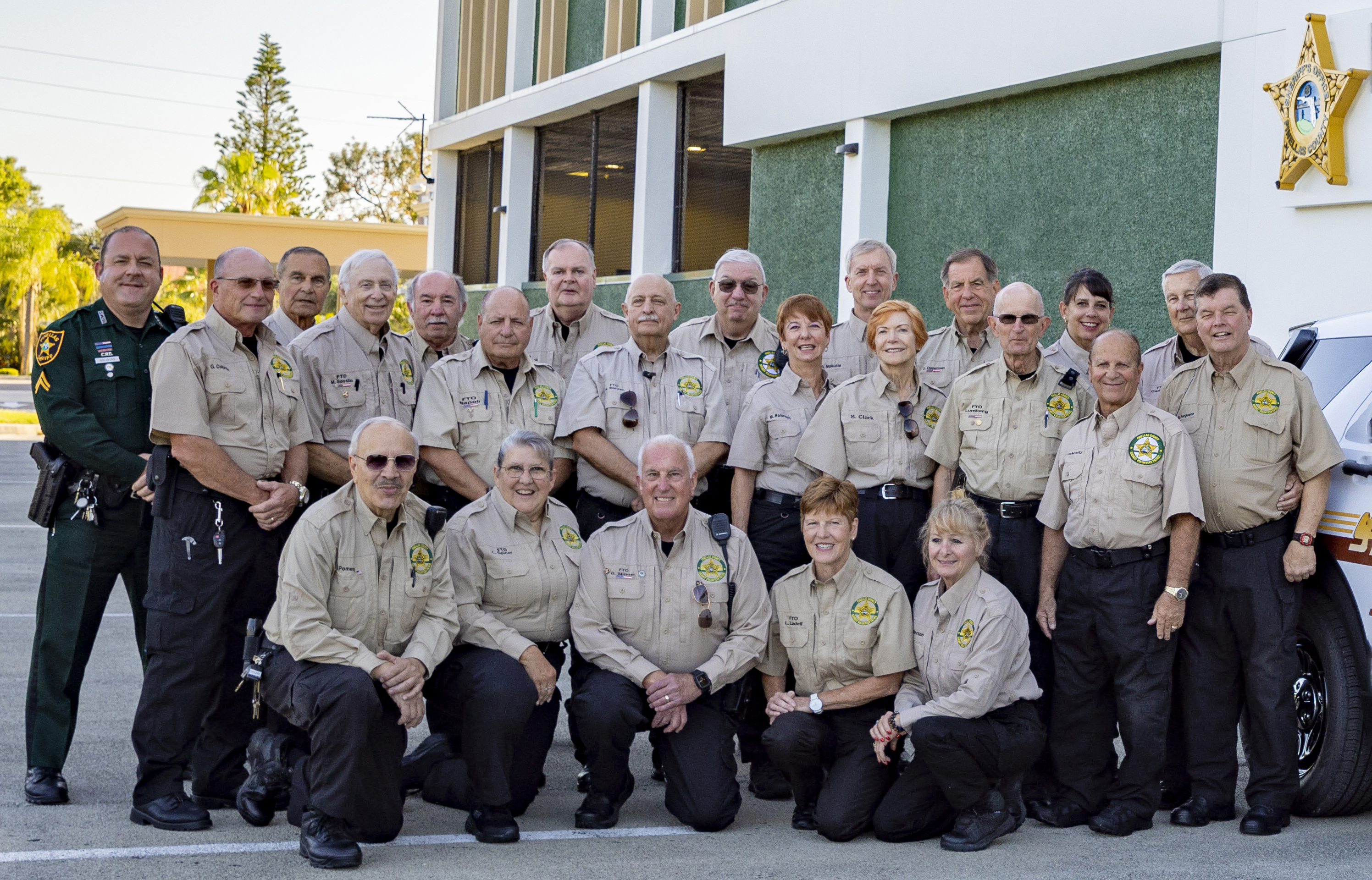 Photo of Volunteers with Squad Car